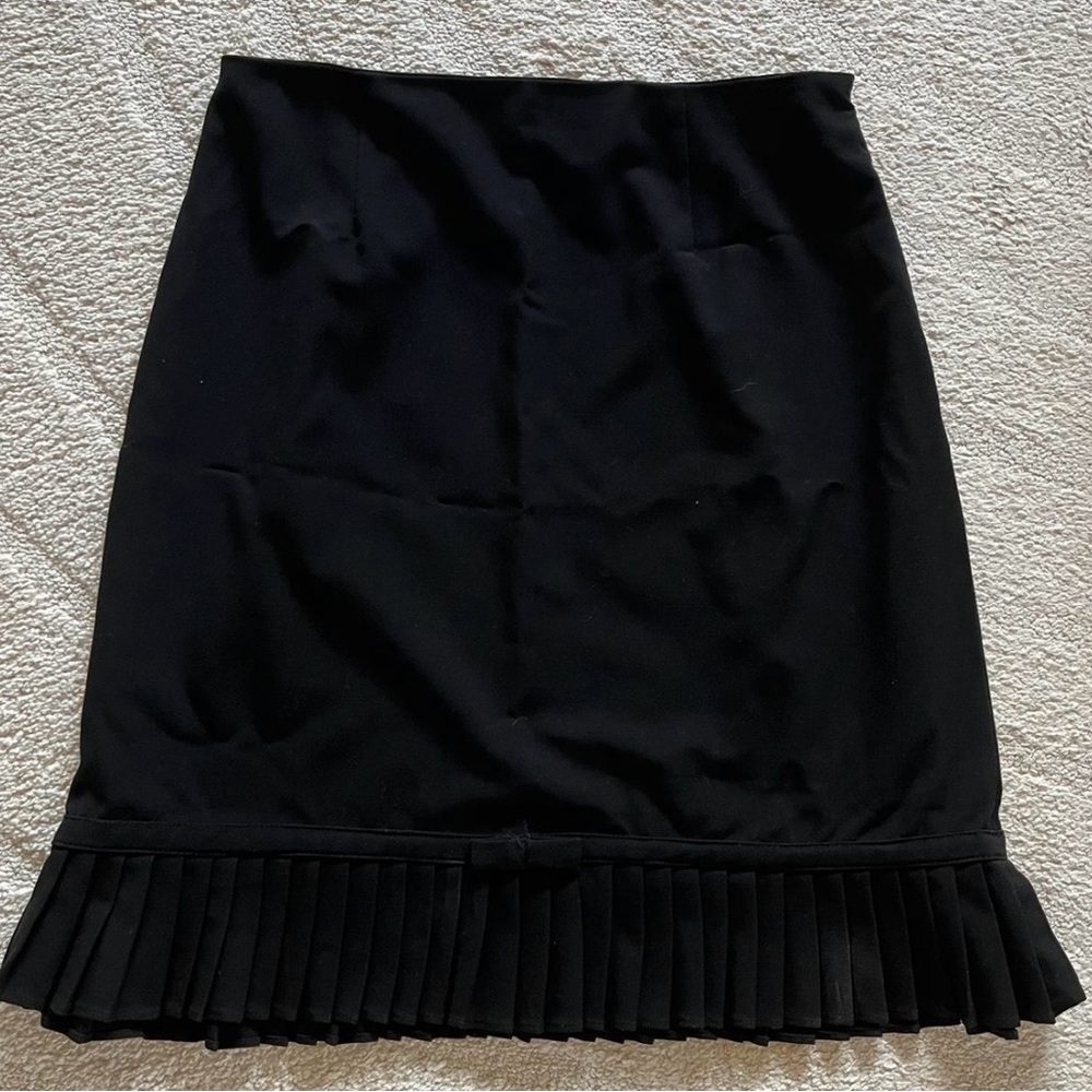 Vintage black skirt with chic bow. Perfect for dressing up or down.